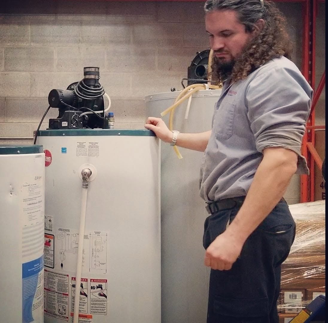 Ryan with Rheem water heaters ready for install
